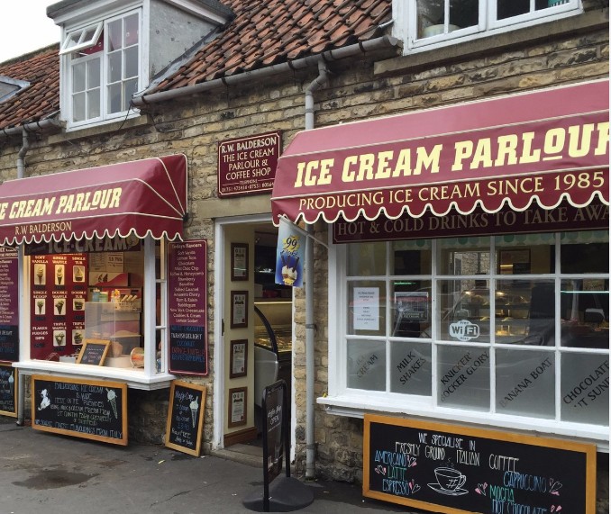 The red-and-cream shopfront of R.W. Balderson Ice Cream Parlour on Thornton-le-Dale's main street