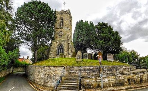 All Saints Church, Thornton-le-Dale, with Thornton Hall visible opposite